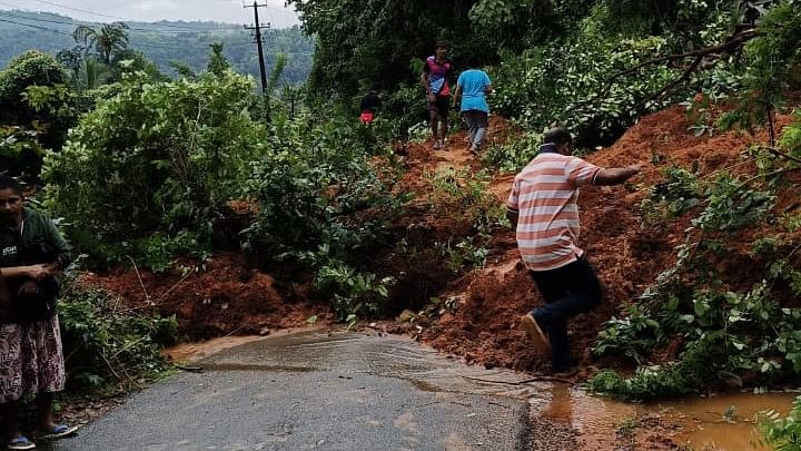 <div class="paragraphs"><p>A man seen moving through the landslide hit area in Moodbidri, Mangaluru.</p></div>